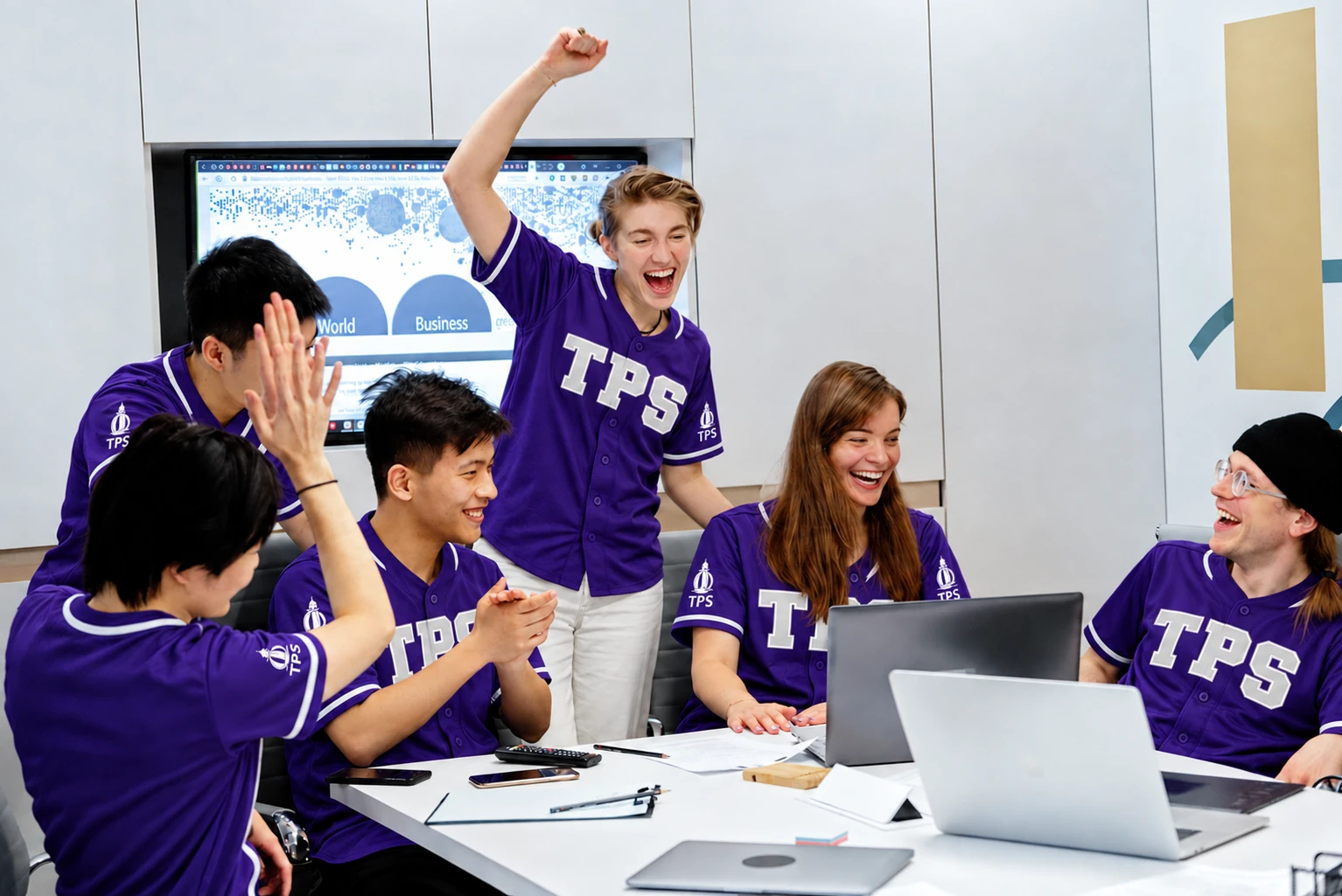 Team celebration styled in purple TPS conference jerseys