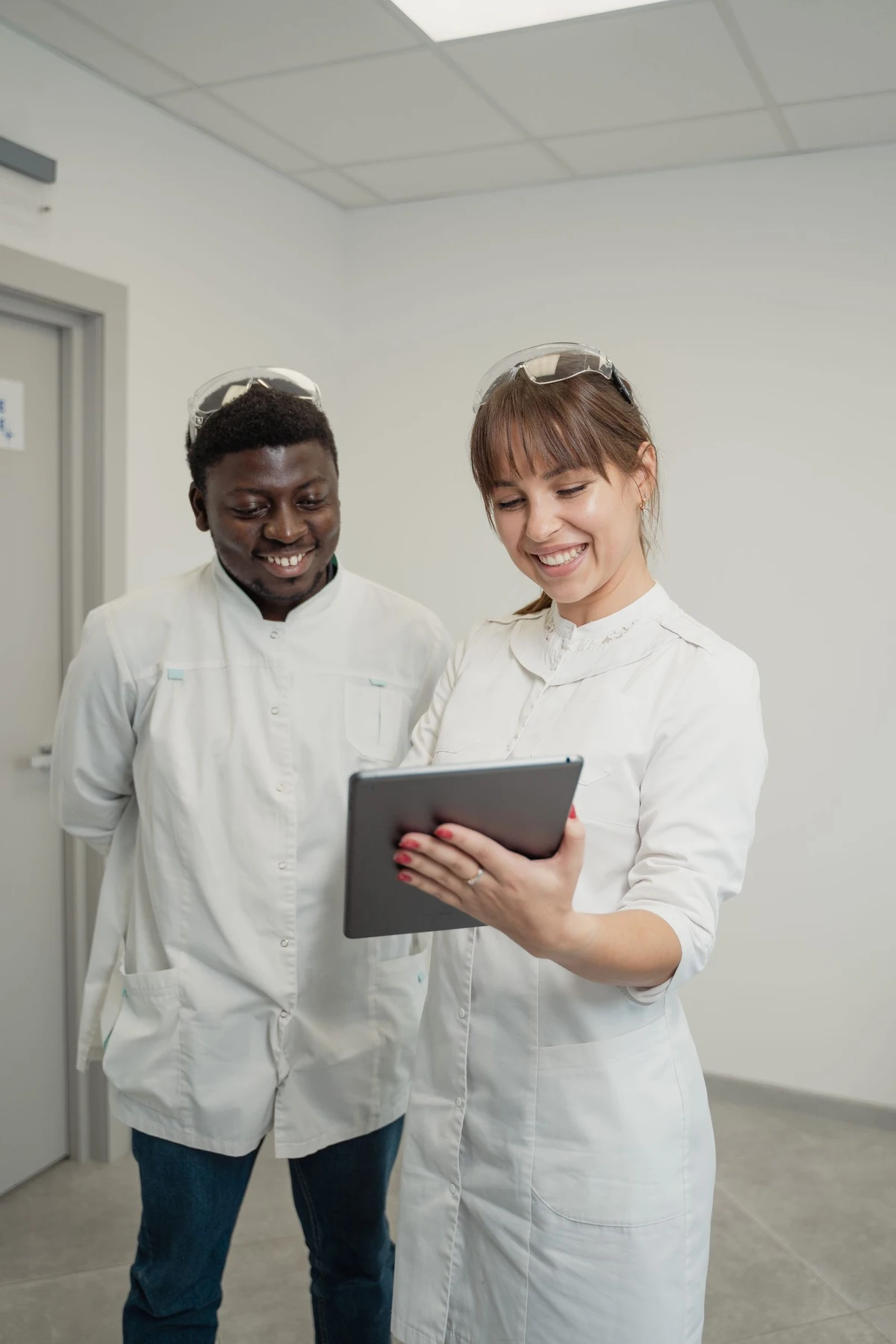 Clinical colleagues reviewing information together on a tablet